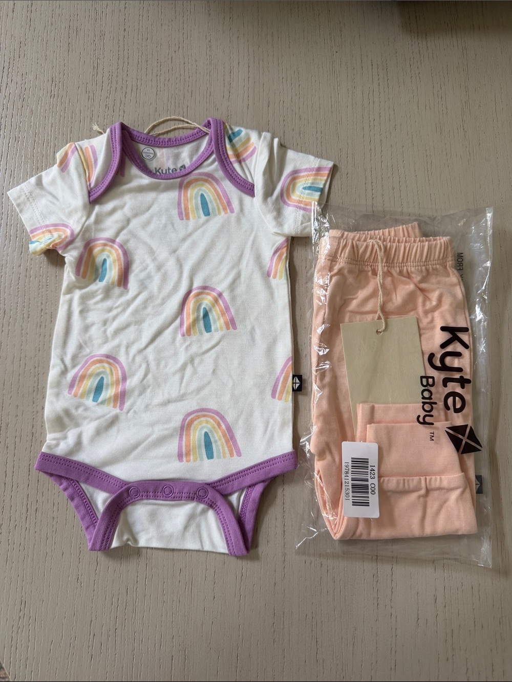 Kyte BABY Cream Rainbow Bodysuit with Purple Trim & Peach Pants